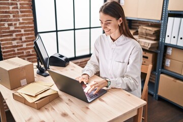 Wall Mural - Young caucasian woman ecommerce business worker using laptop working at office