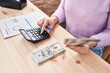 © Krakenimages.com - Young caucasian woman ecommerce business worker holding dollars accounting at office
