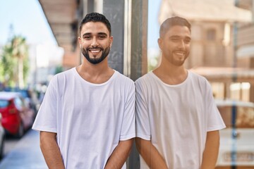 Canvas Print - Young arab man smiling confident standing at street