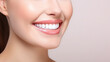 © lelechka - Beautiful female smile after teeth whitening procedure. Dental care. Dentistry concept. Pink background with copy space.