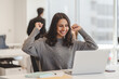 © Maria Vitkovska - Overjoyed Indian woman using laptop computer celebration success sitting in modern office