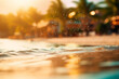 Blurred sandy tropical beach with abstract background of light waves, sun, bokeh