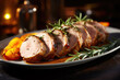 Pork tenderloin with apricots, oranges and rosemary on the plate close up