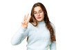 © luismolinero - Teenager girl over isolated chroma key background happy and counting three with fingers