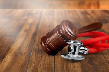 Poster - judge wooden hammer and medical doctor stethoscope