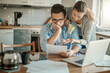 © Geber86 - Young couple reading bad financial report having financial debt at home