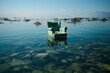 An expensive light green chair stands in the water outdoors. Natural disaster concept.