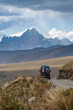 © JoseMaria - green campervan with a high, snow-capped mountain range