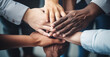 © Viks_jin - Top view of people putting their hands together. Group of Diverse Hands Together Joining Concept. Friends with stack of hands showing unity and teamwork.