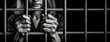 Trapped woman prisoner behind iron bars. Sad adult girl holding a steel cage. Black and white photography. Close-up of hands.