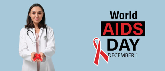 Wall Mural - Female doctor with red ribbon on light blue background. World AIDS Day