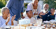 © Charlize D/peopleimages.com - Black family, birthday party and clapping for a boy child outdoor in the yard for a celebration event. Kids, applause and milestone with a group of people in the garden or backyard together in summer