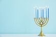 canvas print picture - Menorah with burning candles on table in living room, closeup. Hanukkah celebration