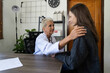 © Natee Meepian - Female doctor giving hope and encouragement to stress woman patient at hospital. Doctor woman touching on patient shoulder to support take care and help. Support and encouraged