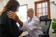© Natee Meepian - Female doctor giving hope and encouragement to stress woman patient at hospital. Doctor woman touching on patient shoulder to support take care and help. Support and encouraged