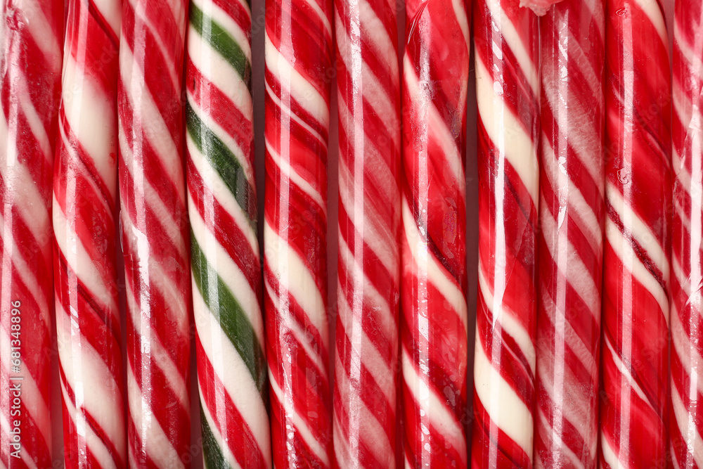 Texture of tasty Christmas candy canes as background, closeup