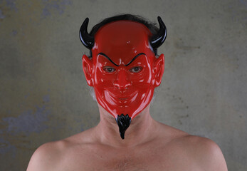 Poster - portrait of a man in a red devil mask