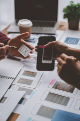 Creative business team in mobile software design project, brainstorming meeting, working together, internet technology in smartphone web part, teamwork concept, colleagues.