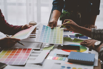 Web creative team Graphic designer planning for mobile phone choose color template draw app website ux ui for mobile application and development model Prototype outline development process.