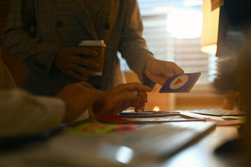 Creative designers planning application process development prototype wireframe for web mobile phone at office