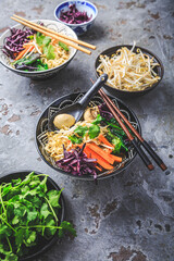 Wall Mural - Vegan miso noodle soup with mushrooms, red cabbage, carrots and sprouts