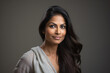 © Synthetica - Portrait of a beautiful middle aged Indian woman, isolated on gray background.