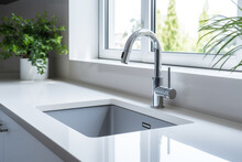 Sleek Modern Kitchen Sink With Faucet And Greenery