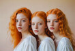 Portraits of red hair triplets teenagers