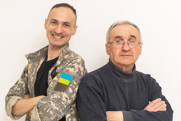 Wall Mural - Soldier in military uniform reunited with his family and Ukrainian flag