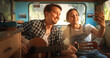 © Kitreel - Happy Smiling Couple Taking a Selfie Photo for Family, Relatives or Friends. Having Funny Conversations on Video Call. Young Man and Woman Travelling in a Motorhome, Recording Video for Social Media