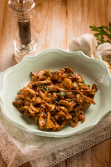 Canvas Print - sauteed chanterelles mushroom with garlic and parsley