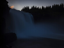 Low Angle View Of Waterfall At Dusk