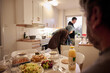 © Johnér - Family preparing dinner together at home