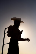 Silhouette Of A Giant Cowboy Statue Againts The Sun In Mojave Desert Along The U.S. Route 66, California