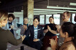 © Davor - Diverse Team Celebrating Colleagues Achievement