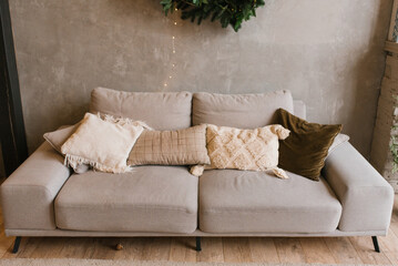 Wall Mural - Gray cozy sofa or couch with pillows in the living room