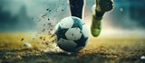 Fototapeta Sport - Close up football player kick the ball in stadium dramatic background. AI generated