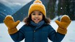 a young girl smiles while making snowballs in the snow