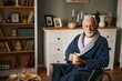 © Stockphotodirectors - Elderly man sitting in wheelchair drinking coffee in the living room