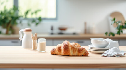 Poster - Freshly baked croissant is presented on a plate next to a white coffee mug and a small bowl of nuts, all arranged on a wooden table with a warm, inviting light.