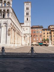 Poster - Glimpse of square San Michele with church and statue in Lucca, Tuscany, Italy