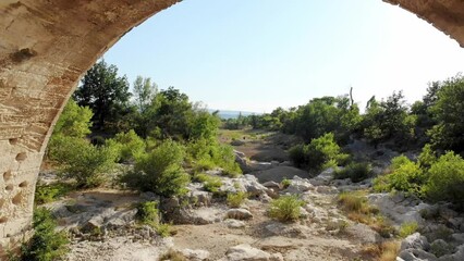 Wall Mural - Aerial drone view of Julian bridge, Roman stone arch bridge in Provence, Southern France