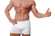© New Africa - Young man is stylish underwear showing thumb up on white background, closeup