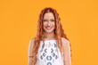 Beautiful young hippie woman on orange background