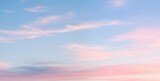 Fototapeta Sypialnia - 淡い青空とピンクにグラデーションする雲