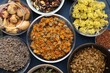 © New Africa - Many different dry herbs and flowers on blue table, flat lay