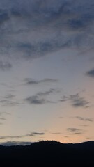 Wall Mural - twilight and dawn sky with cumulus cloud vertical time lapse in an evening.