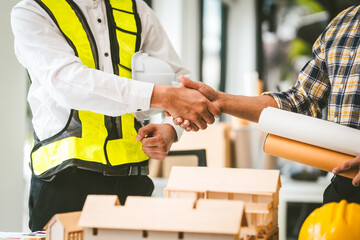 Wall Mural - Two men engineer housing team meeting, one in safety vest holding color swatches, discussing plans, engineers architects talking house design color. Choosing paint for exterior and interior walls