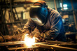 © Surachetsh - The portrait of a male worker in a safety outfit and welding helmet welds metal bars in a factory. Generative AI.