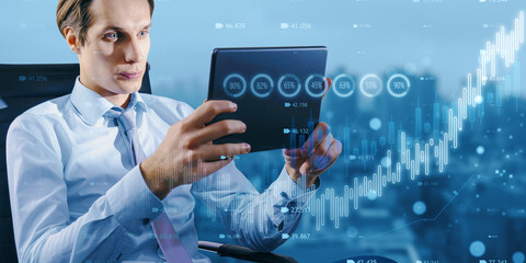 Canvas Print - Businessman touching futuristic digital interface with financial data